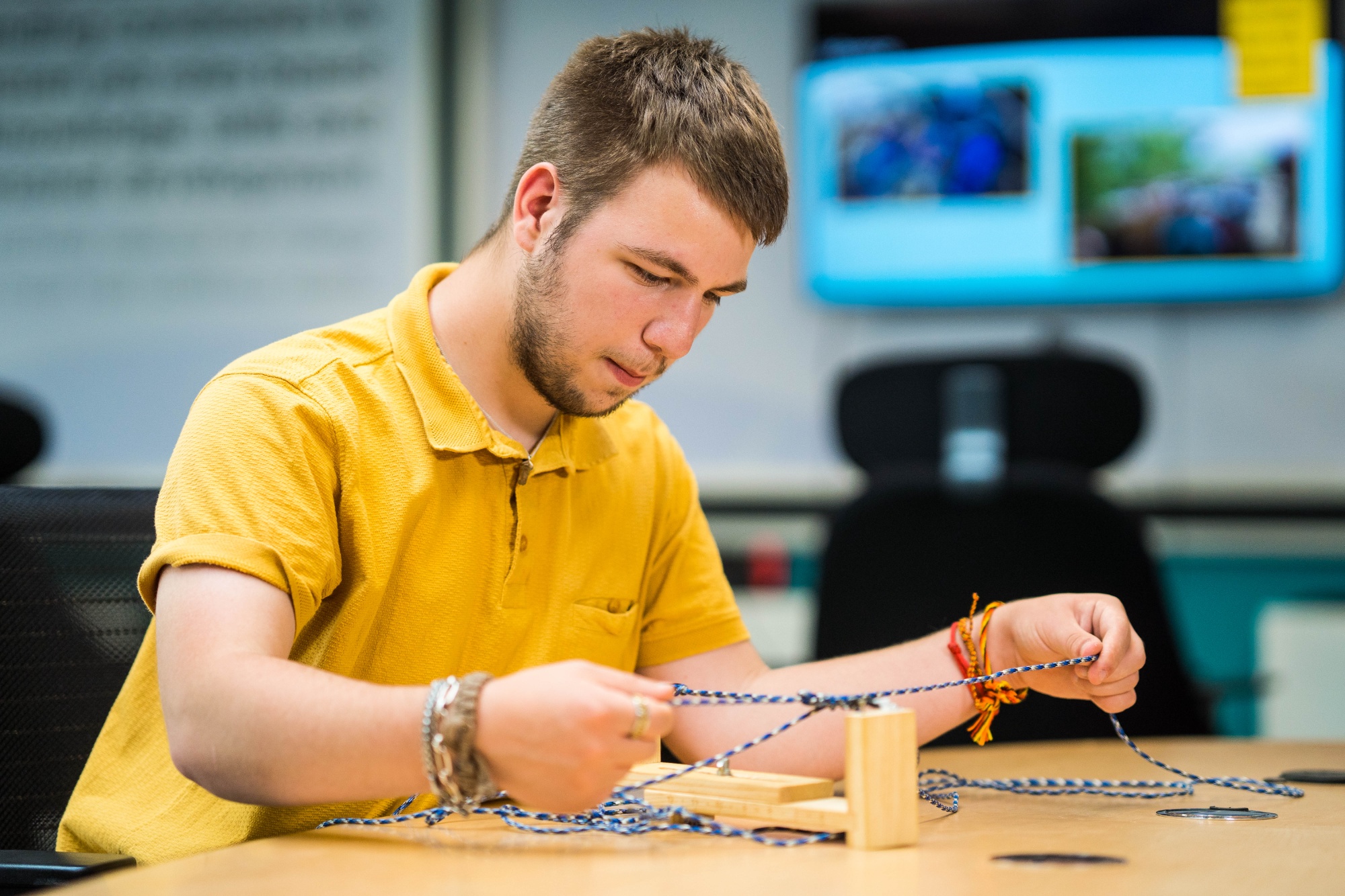 A student busy working on an Enterprise route task in the college classroom.